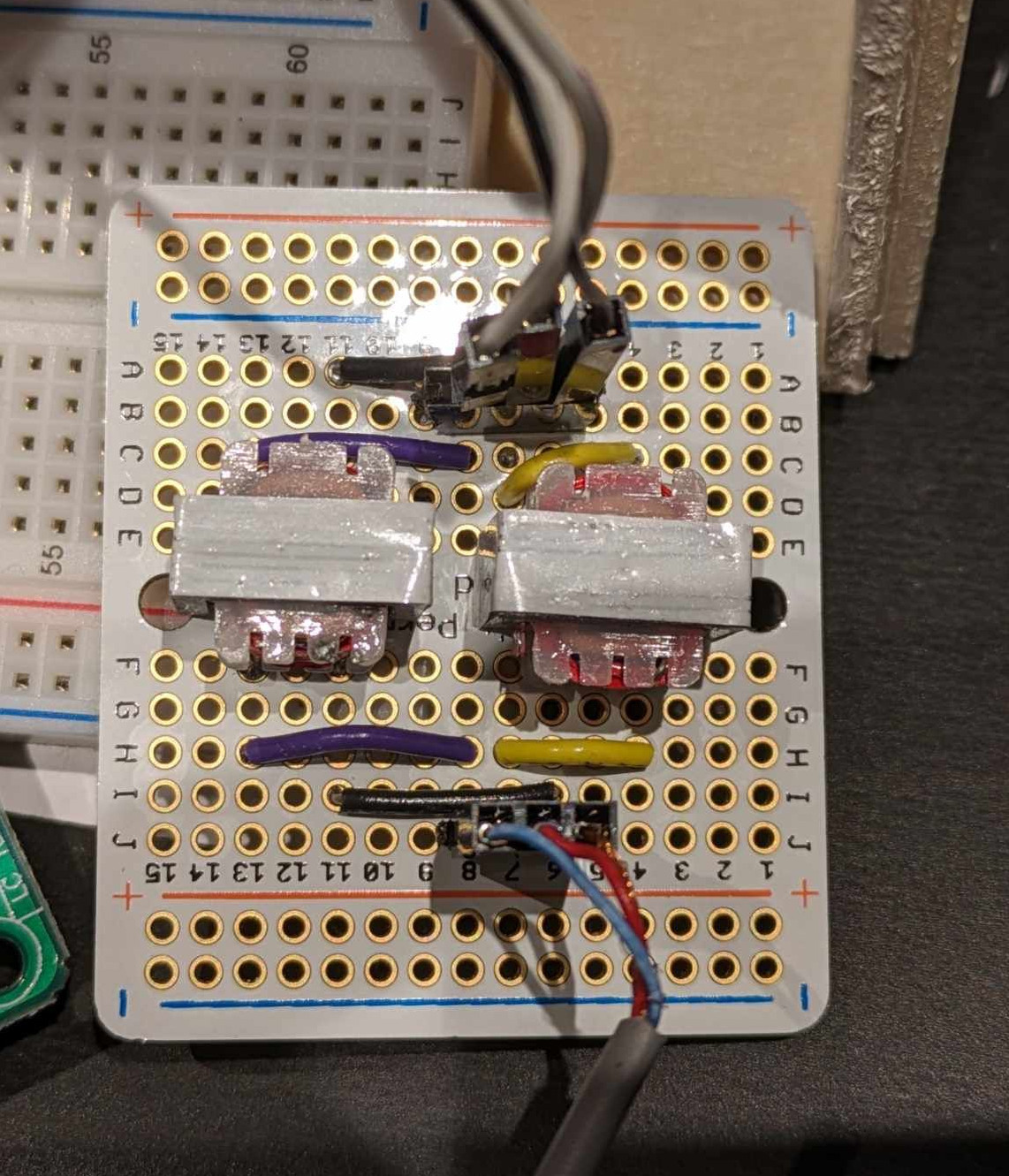 Audio isolation transformers mounted on a board